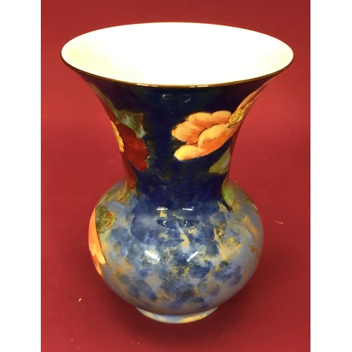 3227 - A Royal Doulton trumpet shaped vase with floral pattern, 18cm high