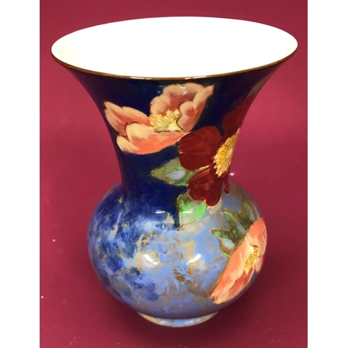 3227 - A Royal Doulton trumpet shaped vase with floral pattern, 18cm high