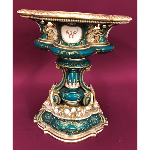 3231 - A Coalport jardiniere on cream and green ground, 34cm high, 28.5cm wide overall (badly cracked)