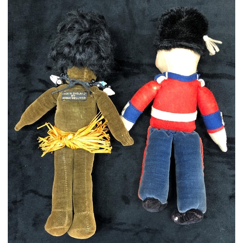 3239 - A Norah Wellings African doll wearing a grass skirt, 22cm long and a similar guardsman doll. (2)