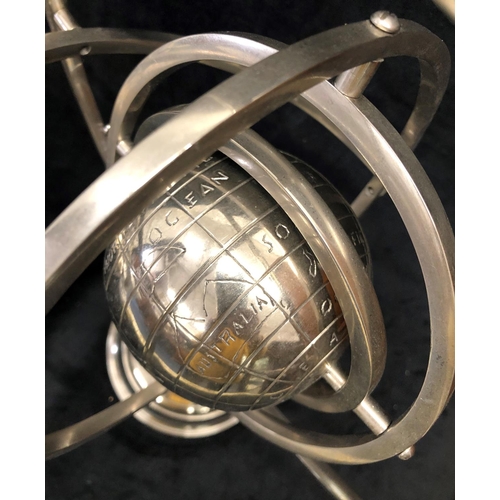 3240 - A chrome Armillary sphere with globe of the earth to centre, 43.5cm high.