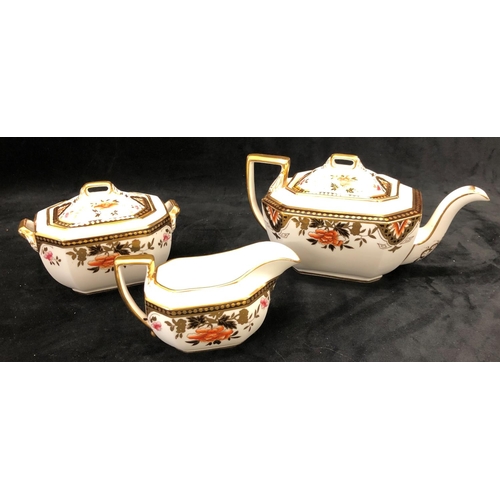 3242 - A Wedgwood Imari teapot, sugar bowl and cream jug. (3)