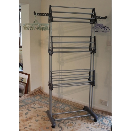 3112 - A grey plastic freestanding clothes rack on wheels, 172cm high overall, 73cm wide, 65cm deep. (This ... 