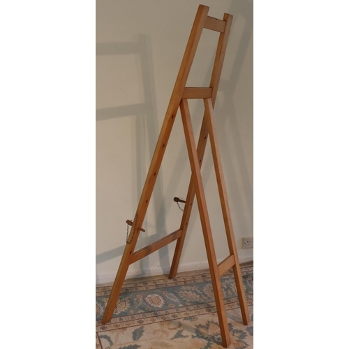 3121 - A large wooden artist's easel 177.5cm high overall, 76cm wide. (This item is not held by PF Windiban... 