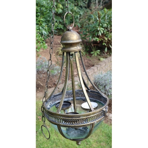 3166 - A brass and glass pendant light fitting with 3 interior candle holders, 55cm high excluding chain, 1... 