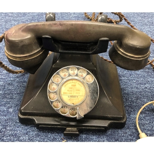 3210 - A black Bakelite telephone.