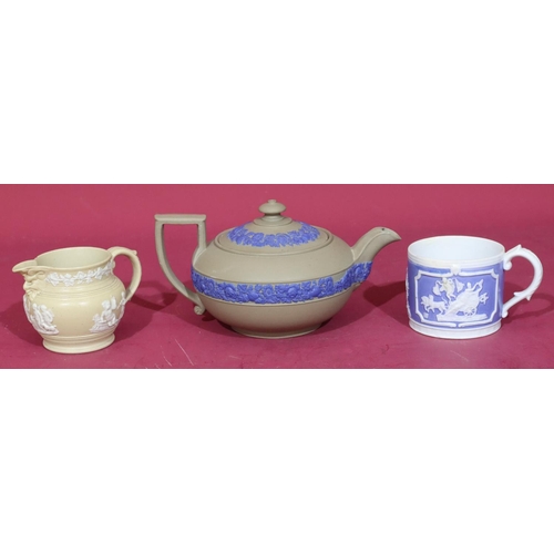 107 - A Wedgwood Jasperware teapot with raised blue floral and leaf decoration (spout and lid chipped), a ... 