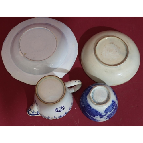 108 - A blue and white tea bowl and saucer with figure, bridge and river landscape decoration, a similar b... 