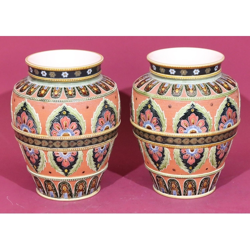 111 - A pair of Mettlach round bulbous thin necked trumpet shaped vases on red and green ground with multi... 