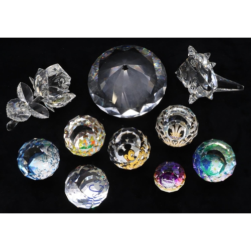 117 - 7 Swarovski crystal round bulbous shaped paperweights, all with multi-coloured inner decoration, a S... 