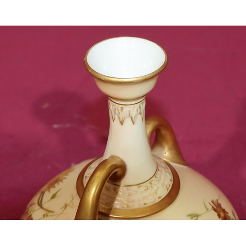 18 - A Royal Worcester Blush round bulbous 2-handled thin necked trumpet shaped vase with multi-coloured ... 