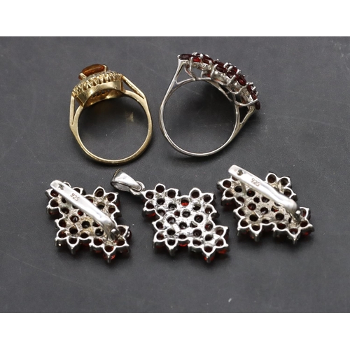 364 - A 9ct gold cluster ring set with yellow centre stone, Size L/M, a silver ladies' cluster ring set wi... 