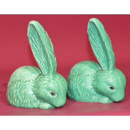 47 - 2 Sylvac figures of rabbits on green ground, 20cm high