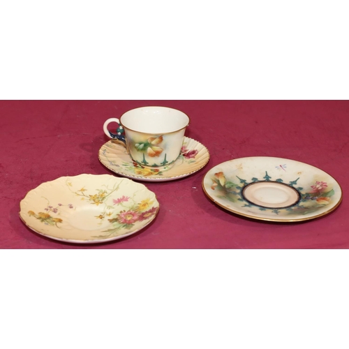 67 - A Hadley's Worcester teacup and saucer with hand painted fruit, floral and leaf decoration (cup chip... 