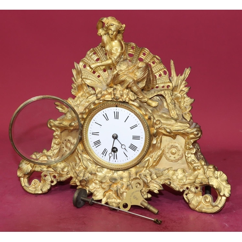 680 - R & C gilt spelter time piece with raised figure motif to top and allover raised floral and leaf dec... 