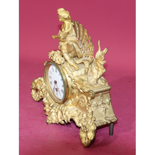 680 - R & C gilt spelter time piece with raised figure motif to top and allover raised floral and leaf dec... 