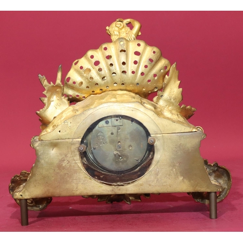 680 - R & C gilt spelter time piece with raised figure motif to top and allover raised floral and leaf dec... 