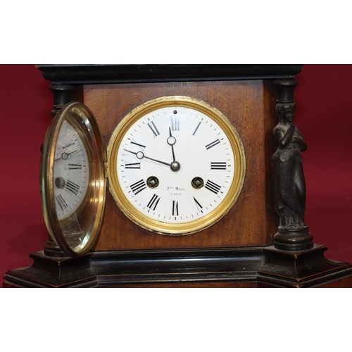 681 - Henry Marc, Paris, walnut and ebonised 8-day striking mantel clock with figure columns, white enamel... 