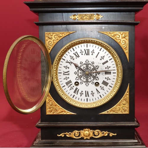 682 - Lenzkirch, black ebonised 8-day striking mantel clock with allover gilt metal mounts and urn finial ... 