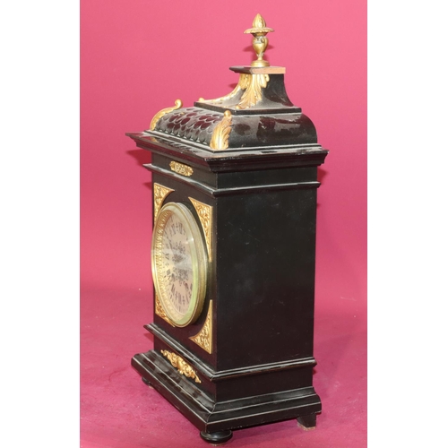 682 - Lenzkirch, black ebonised 8-day striking mantel clock with allover gilt metal mounts and urn finial ... 