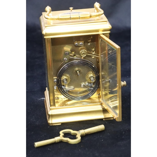 684 - A brass half-striking repeat carriage clock, stamped G & B to movement, with circular white enamel d... 