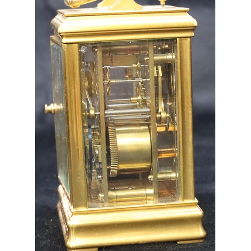 684 - A brass half-striking repeat carriage clock, stamped G & B to movement, with circular white enamel d... 