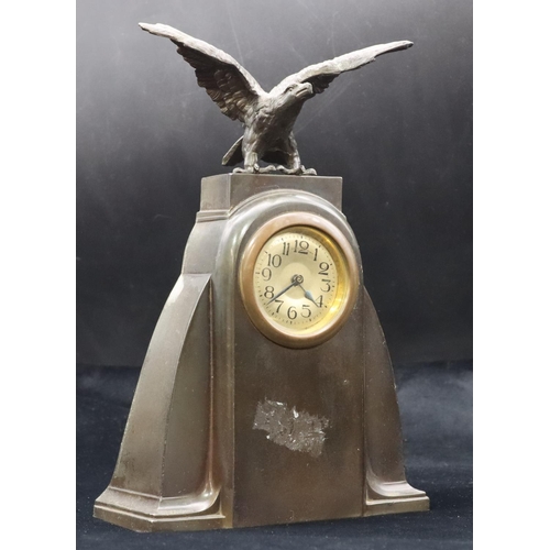 685 - A spelter time piece with bird motif, circular silvered dial with Arabic numerals, 23.5cm high