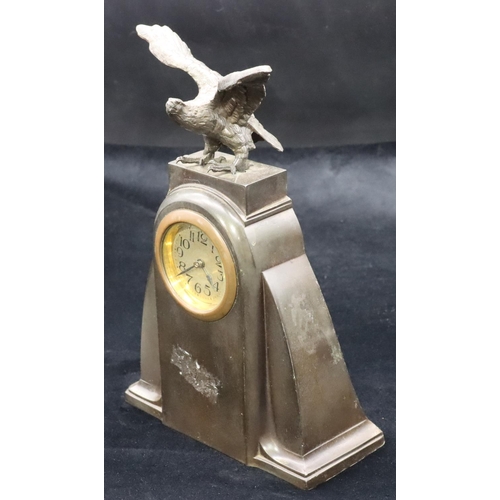 685 - A spelter time piece with bird motif, circular silvered dial with Arabic numerals, 23.5cm high