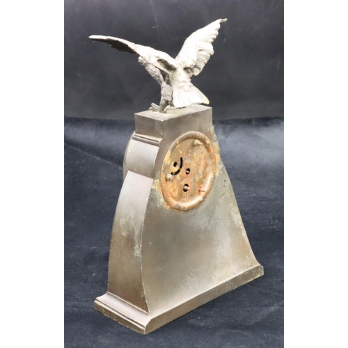 685 - A spelter time piece with bird motif, circular silvered dial with Arabic numerals, 23.5cm high