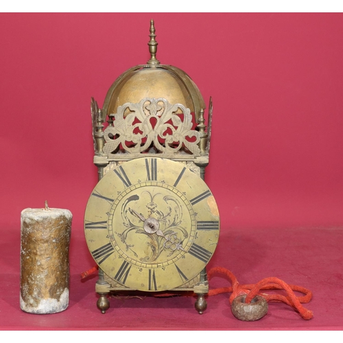 686 - A 17th Century and later brass lantern clock with pierced frets and slender turned finials, chapter ... 