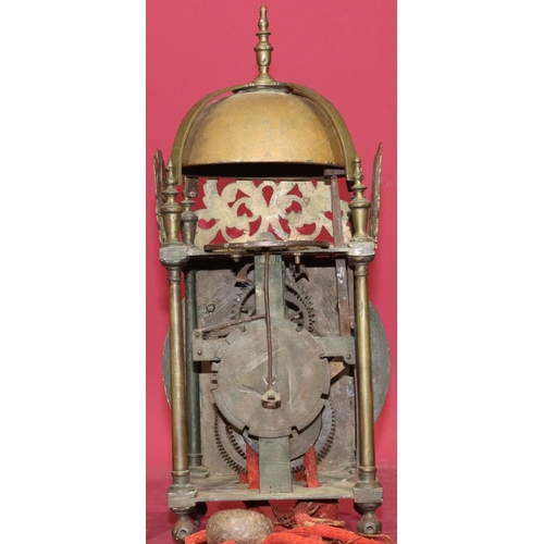 686 - A 17th Century and later brass lantern clock with pierced frets and slender turned finials, chapter ... 