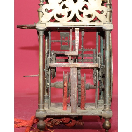 686 - A 17th Century and later brass lantern clock with pierced frets and slender turned finials, chapter ... 