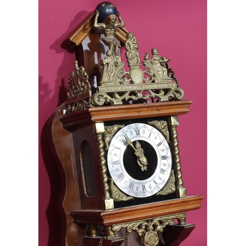 687 - A Continental mahogany and gilt metal hanging wall clock having figure motifs