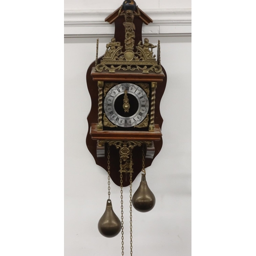 687 - A Continental mahogany and gilt metal hanging wall clock having figure motifs