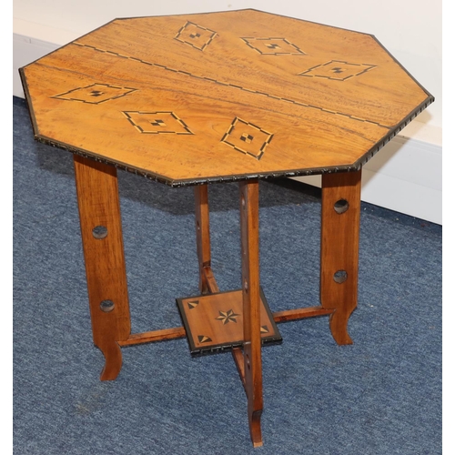 691 - An octagonal low occasional table with inlaid satinwood and ebony boxing and banding, with under tie... 