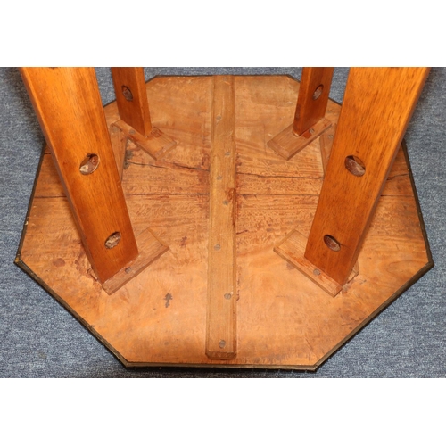 691 - An octagonal low occasional table with inlaid satinwood and ebony boxing and banding, with under tie... 