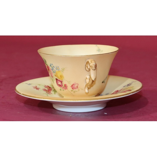 70 - A Royal Worcester Blush 2-handled cup and saucer with multi-coloured floral, leaf and gilt decoratio... 