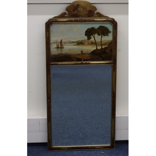 700 - A gilt hanging bevelled wall mirror with painted panel depicting sailing boats with buildings on opp... 