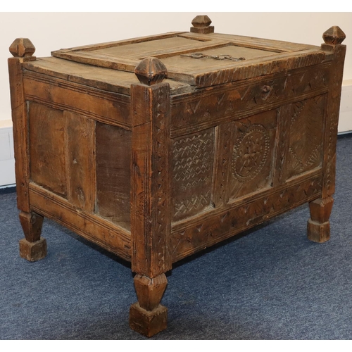 702 - An Eastern small carved trunk with allover carved panels, part hinged lid, on square turned legs, 67... 