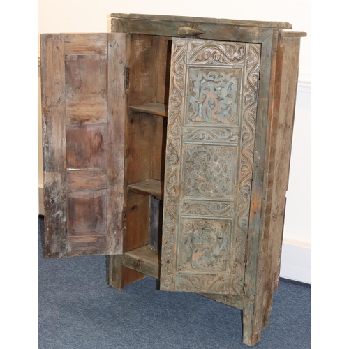 703 - An Eastern carved cabinet with allover raised decoration, on stile feet, 91cm wide, 28.5cm deep, 38c... 