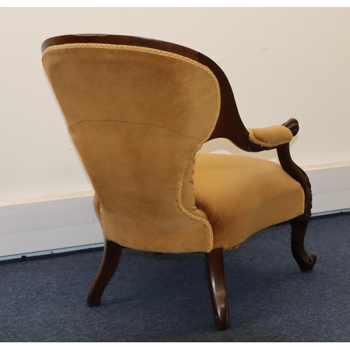 710 - A 19th Century walnut spoon back armchair with beige velvet overstuffed seat, button back and padded... 