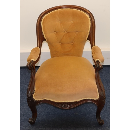 710 - A 19th Century walnut spoon back armchair with beige velvet overstuffed seat, button back and padded... 