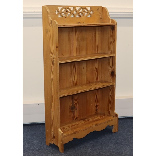 713 - A stripped pine 4-tier open bookcase with pierced decoration to top, 66.5cm wide, 21cm deep, 112cm h... 