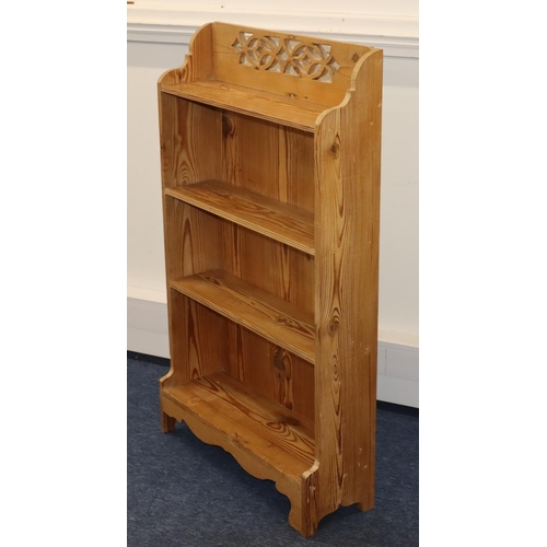 713 - A stripped pine 4-tier open bookcase with pierced decoration to top, 66.5cm wide, 21cm deep, 112cm h... 