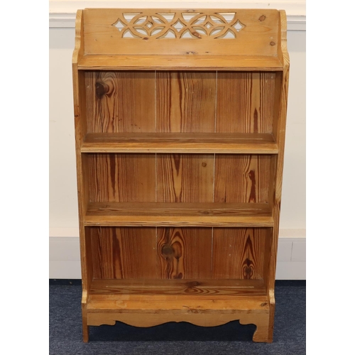 713 - A stripped pine 4-tier open bookcase with pierced decoration to top, 66.5cm wide, 21cm deep, 112cm h... 