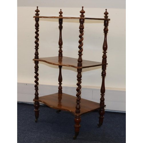 715 - A 19th Century 3-tier Serpentine fronted whatnot with barley twist supports, turned legs on brass to... 