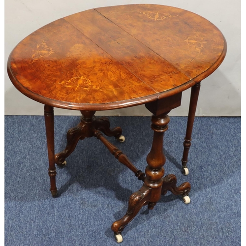 719 - A Victorian burr walnut small oval Sutherland table with part inlaid stringing, on turned stem with ... 