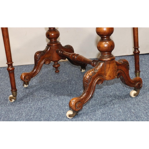 719 - A Victorian burr walnut small oval Sutherland table with part inlaid stringing, on turned stem with ... 