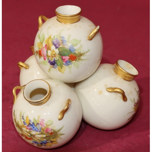 72 - A Royal Worcester vase in the form of 4 balancing bulbous 2-handled vases on white and gilt ground w... 