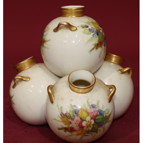 72 - A Royal Worcester vase in the form of 4 balancing bulbous 2-handled vases on white and gilt ground w... 